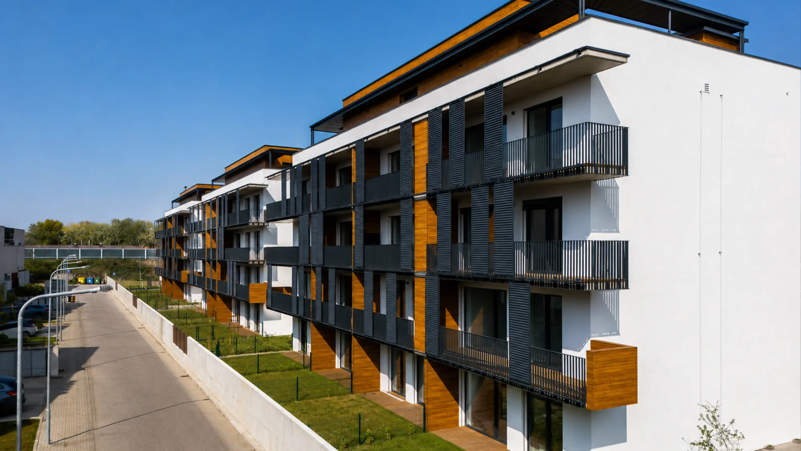 View of the residential buildings of the Laurin dvor development in Bratislava. Modern architecture with spacious balconies, private front gardens and well-designed outdoor spaces creates comfortable living for individuals and families. - obrázok 5