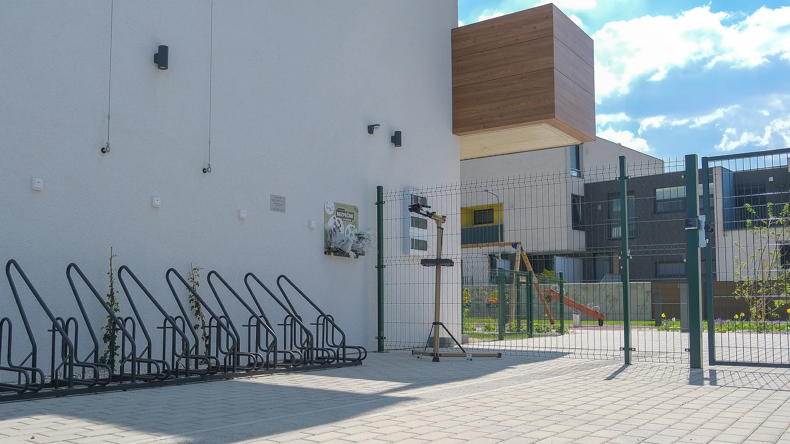 Residential project Laurin dvor – Exterior - space between houses equipped with several bicycle stands and a set of tools for repair and maintenance of bicycles. - obrázok 20