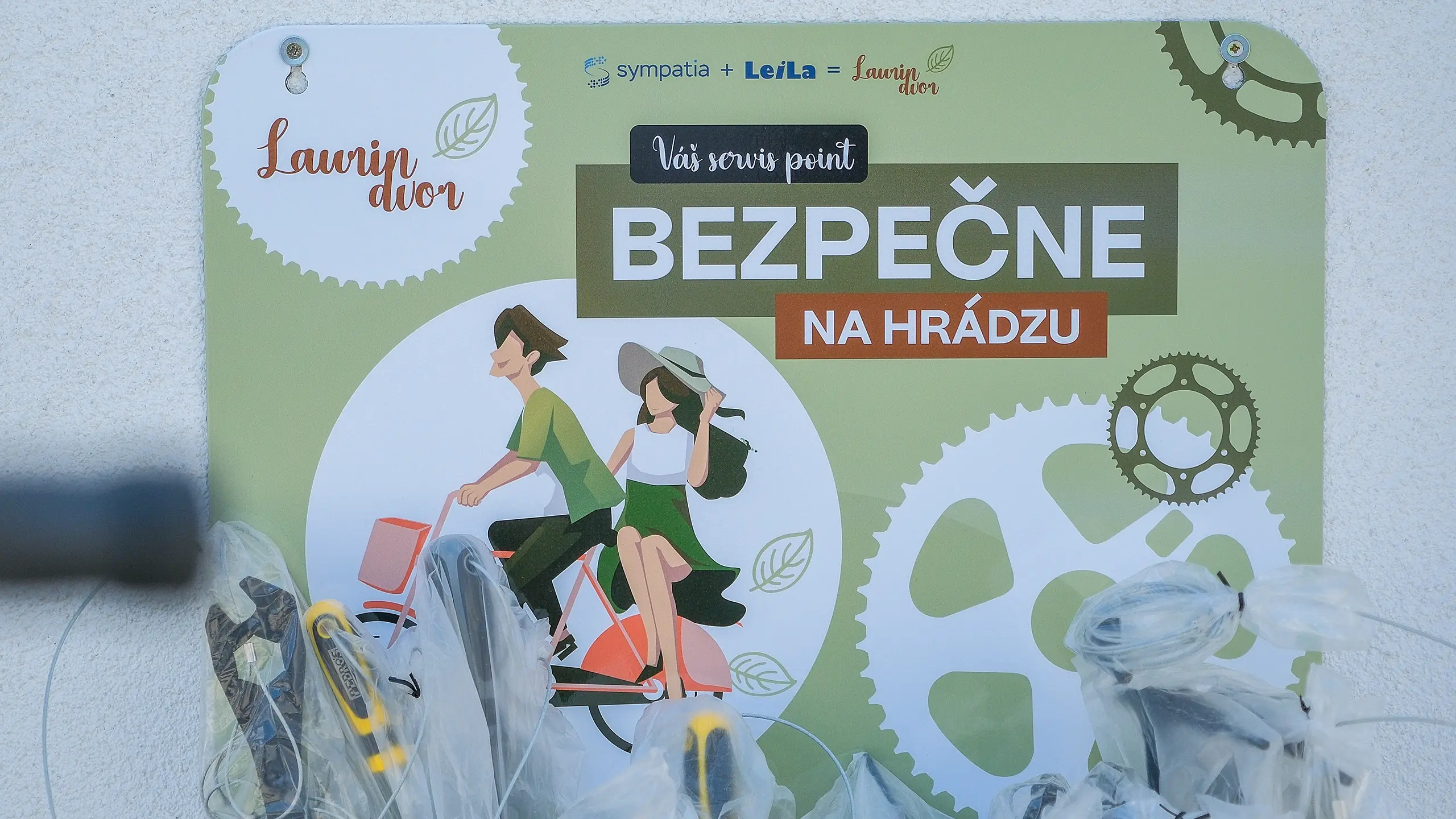 Residential project Laurin dvor – colorful metal plaque with the inscription "your service point", on which bicycle repair tools are attached. - obrázok 21