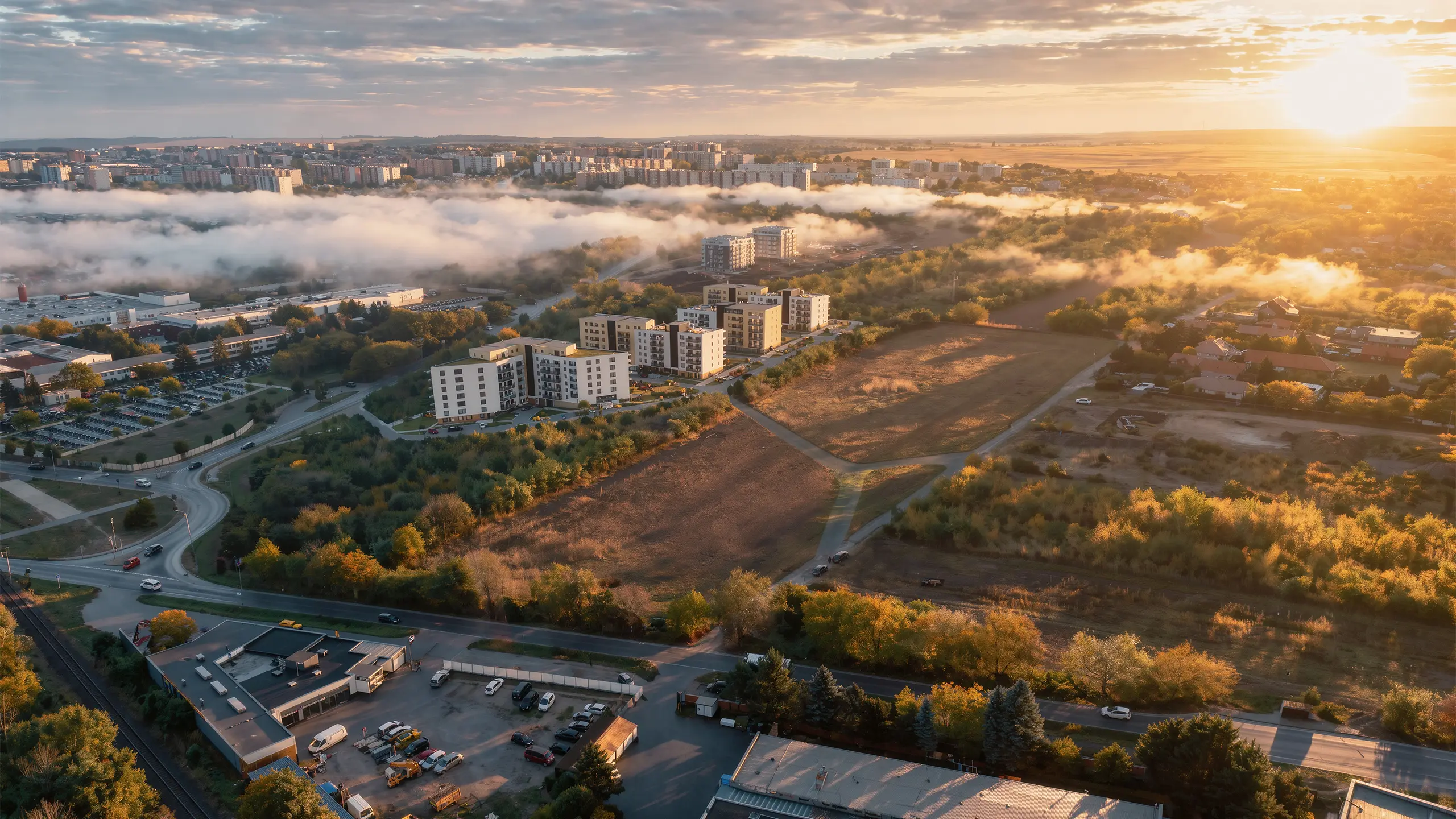 Visualization of the Nitrea 1 residential development in Nitra – Mlynárce, featuring modern apartment buildings and landscaped green surroundings. - obrázok 12